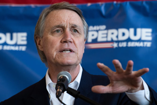 UNITED STATES - NOVEMBER 2: Sen. David Perdue, R-Ga., who is running for reelection, speaks during a campaign event at Peachtree Dekalb Airport in Atlanta, Ga., on Monday, November 2, 2020. Sen. Tim Scott, R-S.C., also attended. (Photo By Tom Williams/CQ Roll Call)